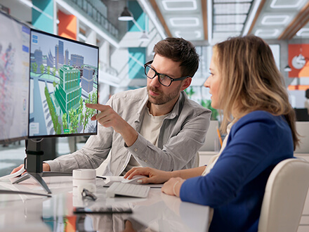 Energy modeling specialists analyzing a digital model of a commercial building